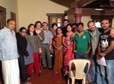 Participants of the cluster meeting with the cast and crew on the sets of a local film production