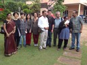 Participants of the cluster meeting with the cast and crew on the sets of a local film production